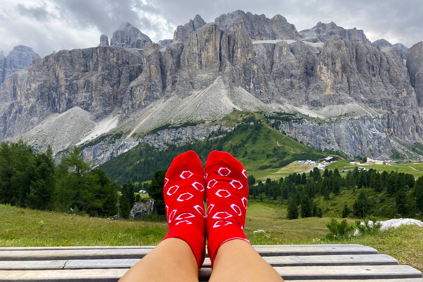 Swisslog socks with a view of large mountains