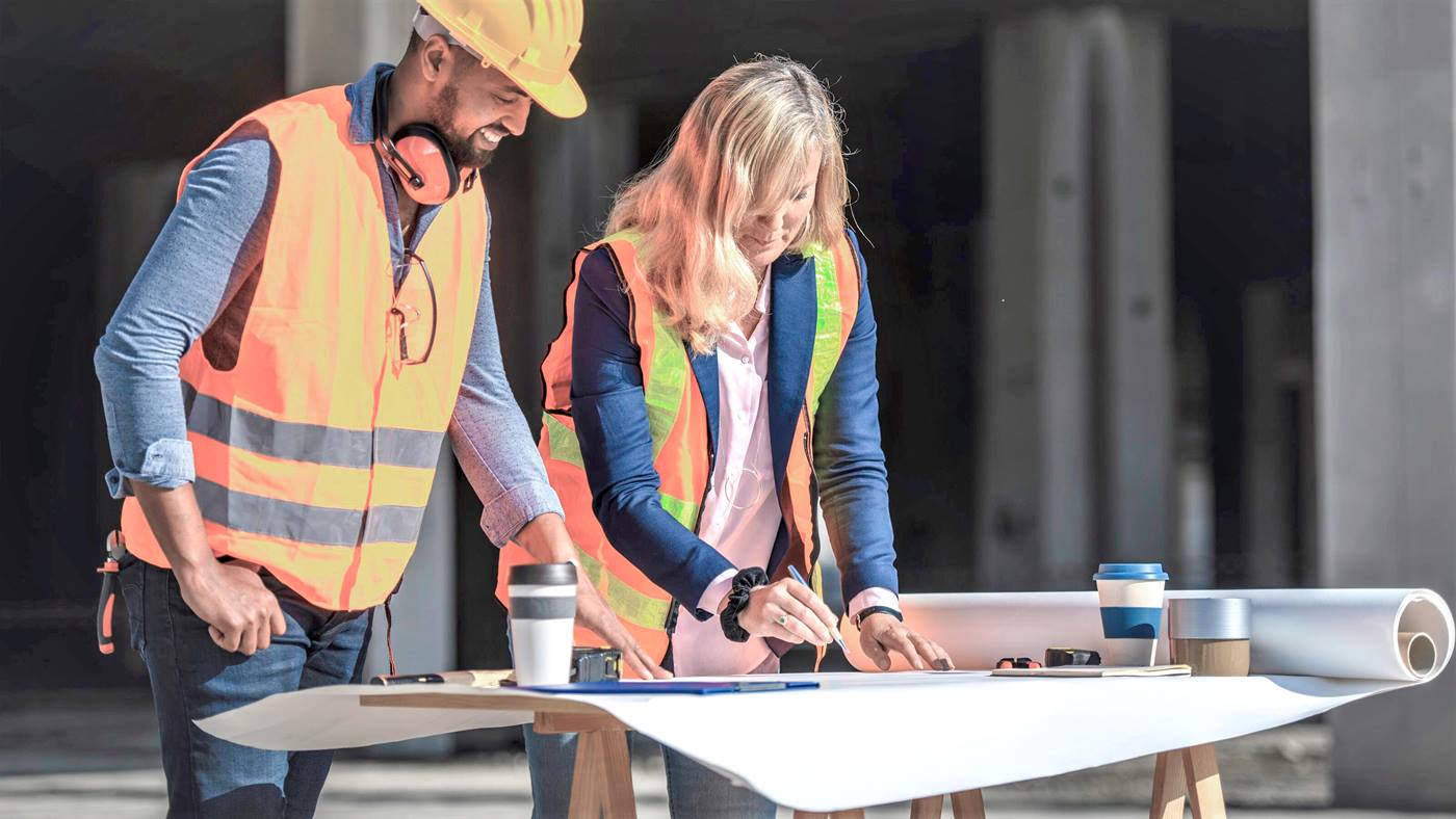 Construction workers checking plans