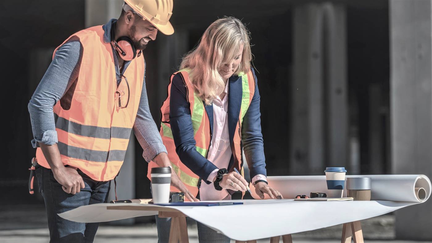 Construction workers checking plans