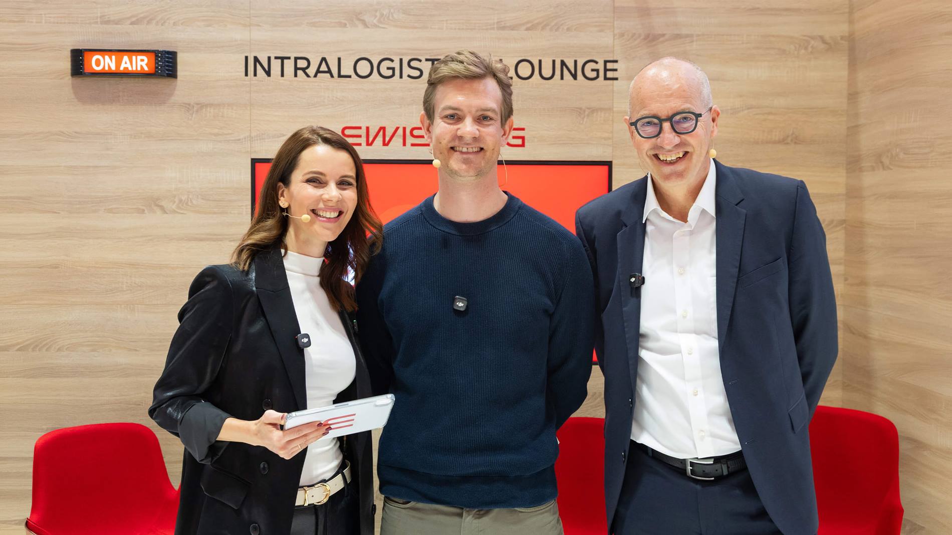 Host Franziska Zimmermann, AutoStore CEO Mats Hovland Vikse, Swisslog CEO Jan Zuurbier