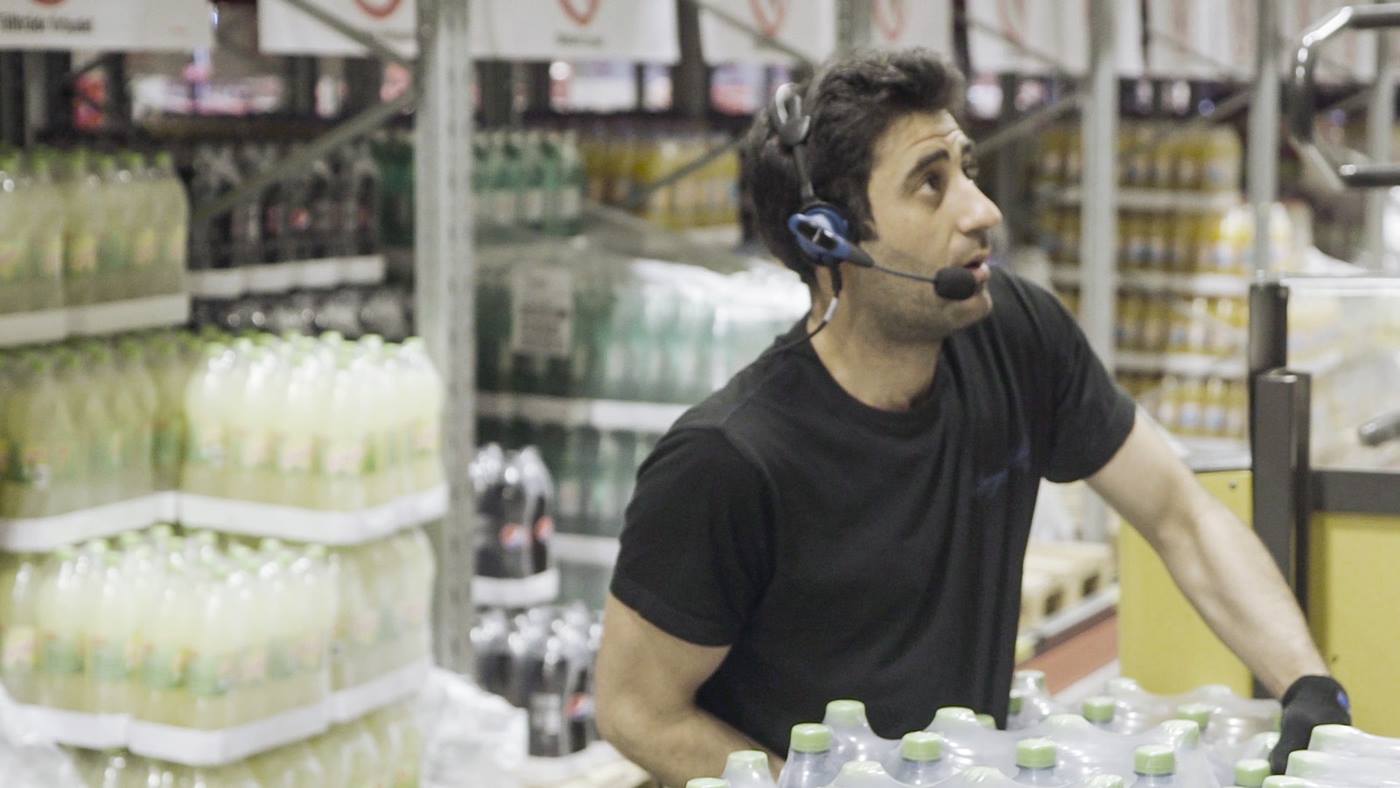 Bergendahl’s Food worker picks drinks for delivery to store 