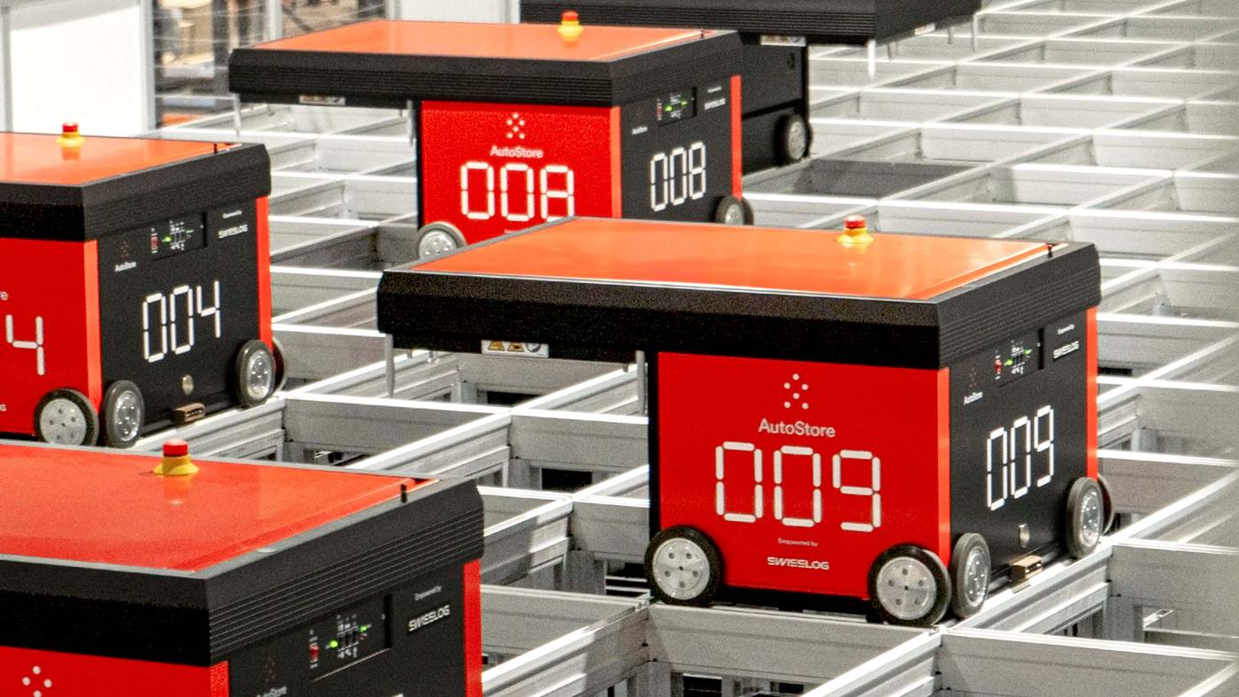 Swisslog AutoStore robots navigating a grid-based automated storage system