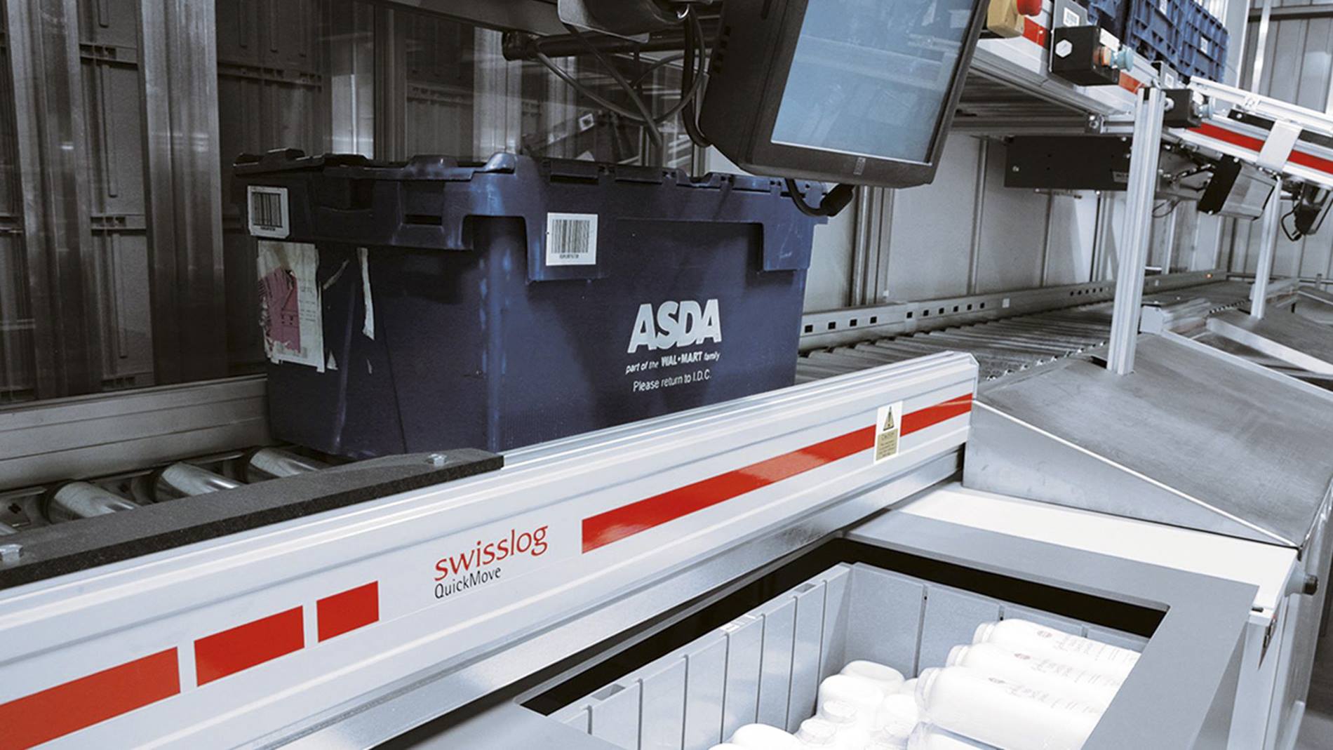 Picking station at Asda IDC integrated distribution center in Lutterworth, UK