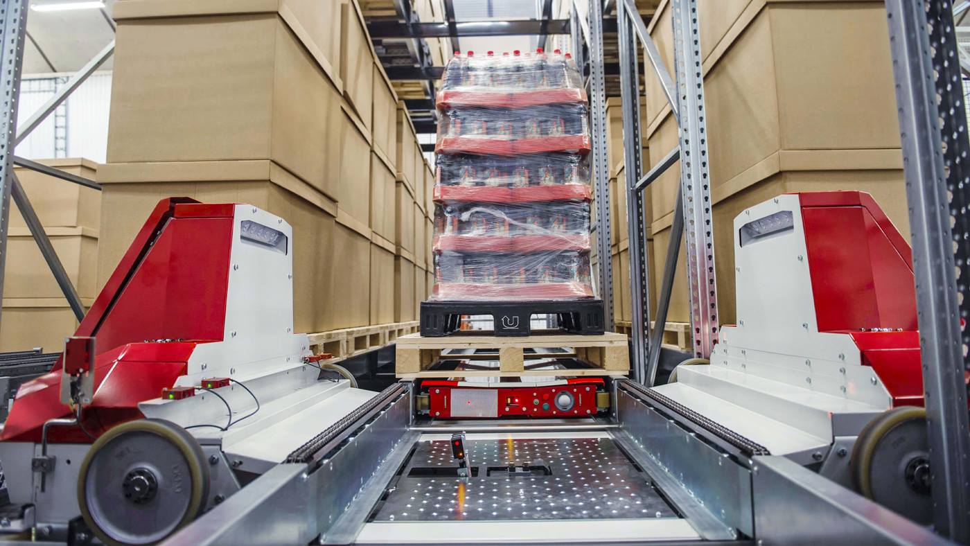 Swisslog PowerStore pallet shuttle transporting goods within a high-density pallet storage ASRS system