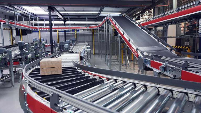 Swisslog QuickMove conveyor for efficient transport of small loads.