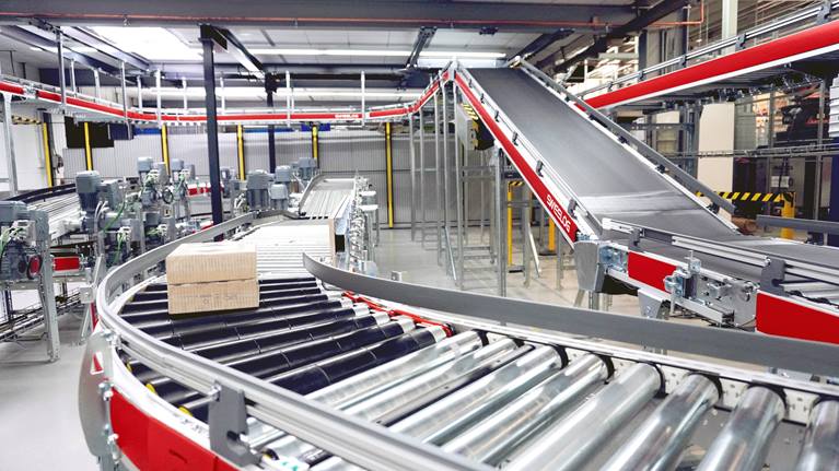 Swisslog QuickMove conveyor for efficient transport of small loads.