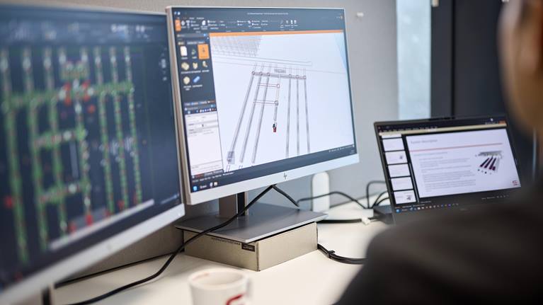A warehouse automation solution designer working on a design
